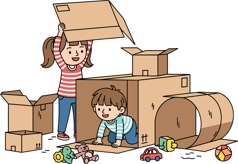 Two kids building a fort out of cardboard boxes